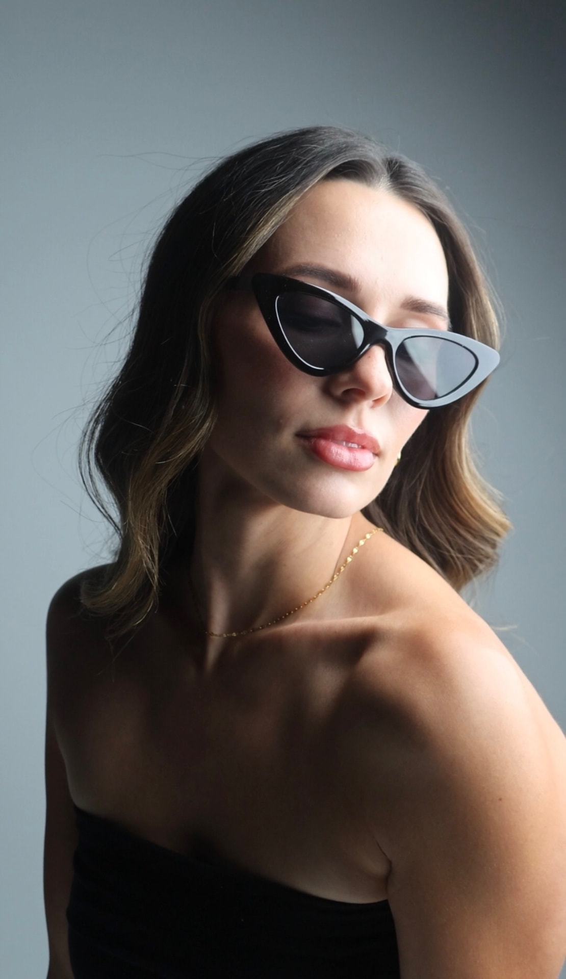 The Chic Collection mood — editorial portrait in black cat-eye shades
